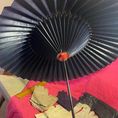 Many women s vintage gloves and a paper parasol