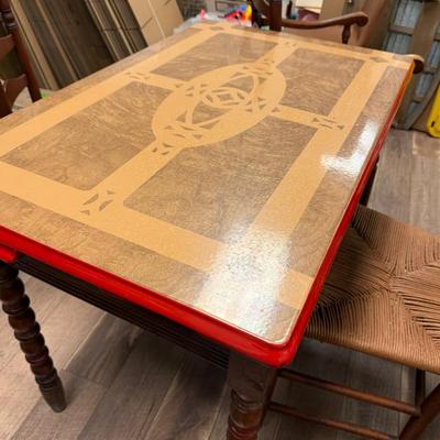 Lot 458: Vintage Red Trim Enamel Top Table with 4 Ladder-Back Rush Seat Chairs