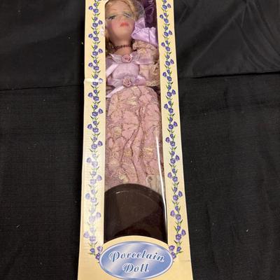 Lot 639: The Anastasia Collection Porcelain Doll – 18” Victorian Style Doll in Lavender Gown with Bo