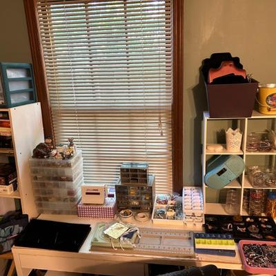 Crafts area featuring tools and equipment for making jewelry. 