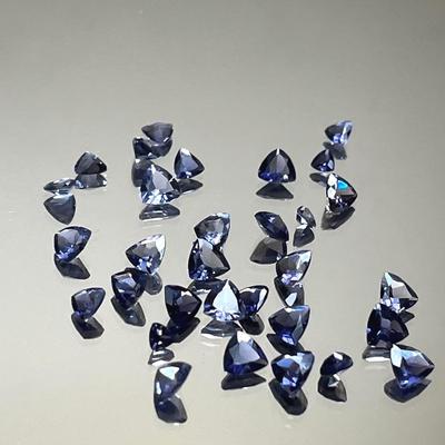 Tanzanite Trillion Cut 7.55 CTTW, Mixed Sizes Up to 4x4mm