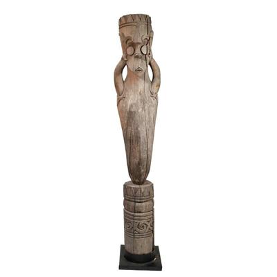 TALL WOODEN TOTEM-STYLE SCULPTURE | Carved wooden sculpture with abstract tribal-style motifs, mounted on a black base - h. 80 x w. 14 x...