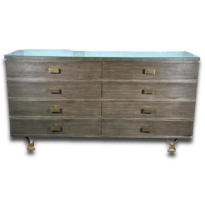 MODERN HISTORY LINEAR DRESSER | Having 6 drawers with rectangular brass pulls raised on bronze feet - h. 37.5 x w. 70 x d. 29 in
