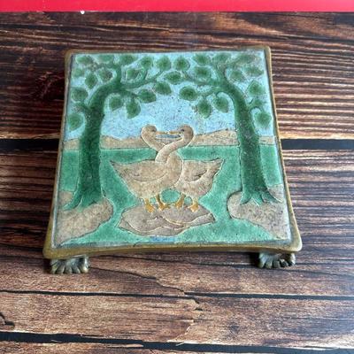 Circa 1917 molded Grueby Pottery Tile set in a bronze trivet by Tiffany Glass Company (Louis Comfort Tiffany)
