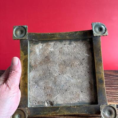 Circa 1917 molded Grueby Pottery Tile set in a bronze trivet by Tiffany Glass Company (Louis Comfort Tiffany)
