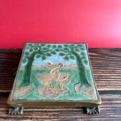 Circa 1917 molded Grueby Pottery Tile set in a bronze trivet by Tiffany Glass Company (Louis Comfort Tiffany)