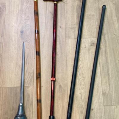 (4) Wood/Metal Canes And (1) Small Sword