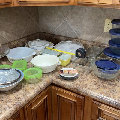 A Collection Of Kitchen Glass Featuring Pyrex And Corning Ware