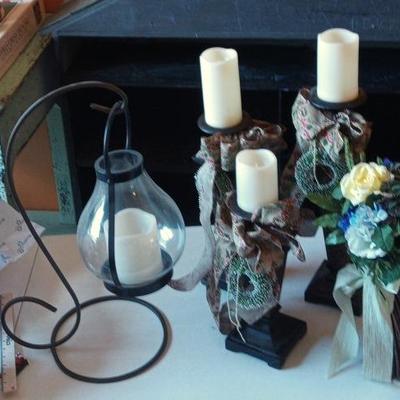 Collection Of Led Candle Holders And Floral Display