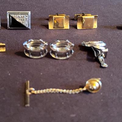 Collection of unique cuff links, tie tacks and pins