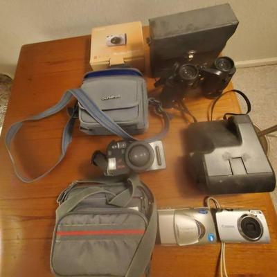 (4) Cameras - Olympus, Canon, Polaroid, (1) Bushnell Binoculars 