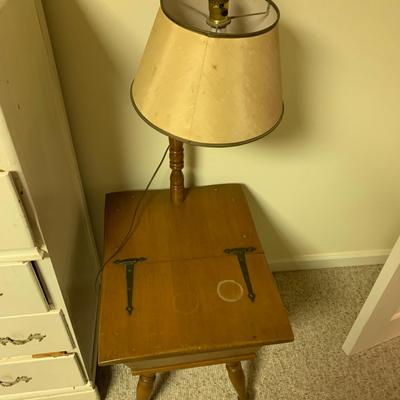 Wood table with attached lamp