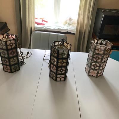 3 hanging glass and metal lamps. one does not have lighting
12in H 6in W