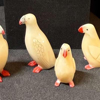 Four inuit carved puffin figurines