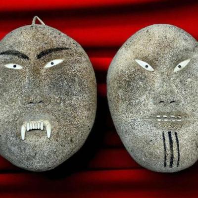 Inuit carved maskettes male female pair