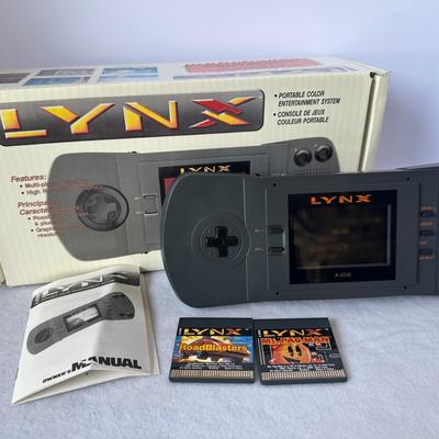 Atari Lynx Portable Game Console with Box, Manuals, and Games (screen not showing picture)