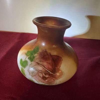 Milk glass vase with rose