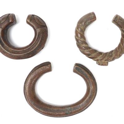 Sale Photo Thumbnail #136: Lot 136 group lot of three african currency bracelets