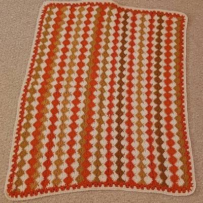 Orange And White Crocheted Blanket