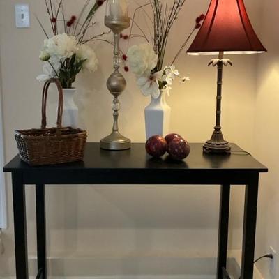 Elegant Console Table Display with Floral Accents