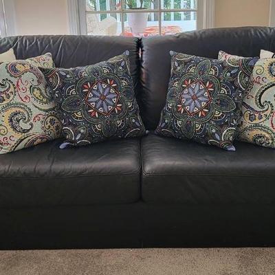 Black Leather Sofa with Accent Pillows