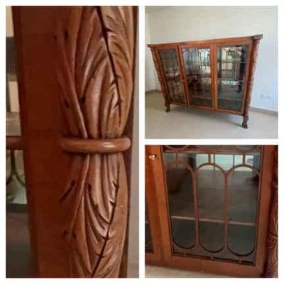 Carved display case with french doors and keys