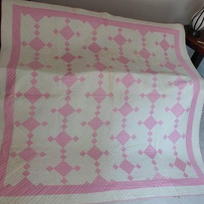 Handmade pink and white quilt