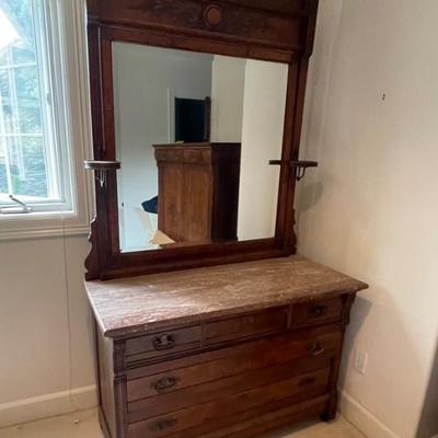 Stone topped carved dresser with mirror
