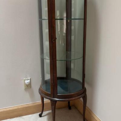 Round curio cabinet with thick glass shelves