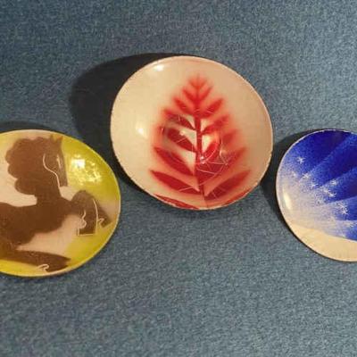 Three small enameled plates by winter