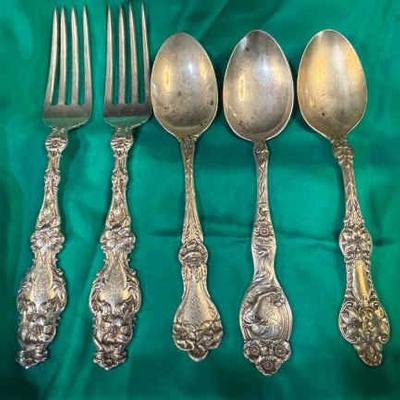 Monogrammed sterling spoons forks