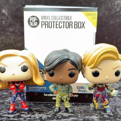 Unboxed Collection Of Captain Marvel Funko Pops! And One Protector Box