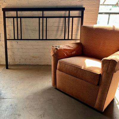 A Vintage Upholstered Armchair with a Modern Arts & Crafts Style Queen Steel Headboard