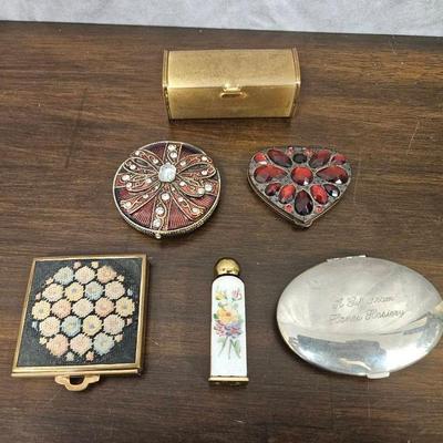 Assortment Of Vanity Mirrors And Perfume Bottle