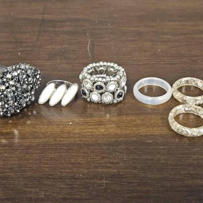 6 Silver Tone And Plastic Rings