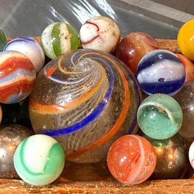 Vintage latticinio core marble others in vintage wood boat