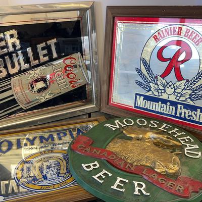 Beer, Signs. Beer, signs. Coors light, silver bullet, Rainier, beer, Olympia, beer, Moose head beer.