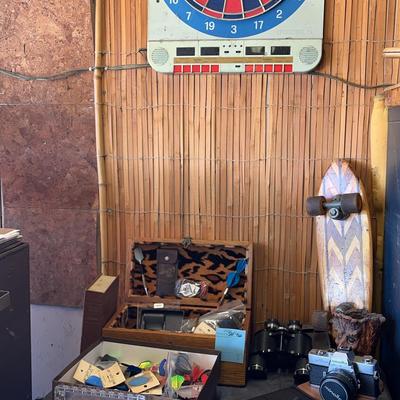 Dart Board, Accessories, Minolta SRT202, Polaroid Camera And Wooden Skateboard 