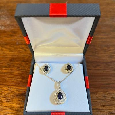 Lot 323: Sterling Silver With White And Blue Sapphire Earrings And Necklace Set