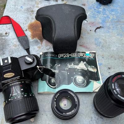 Lot 256: Vintage Japanese Yashica FX3 Plus Case And Lenses