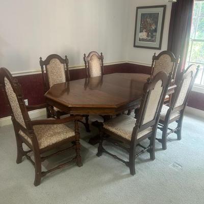 Dining set with attached leaf