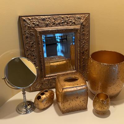 Assortment of Golden Bathroom Accessories