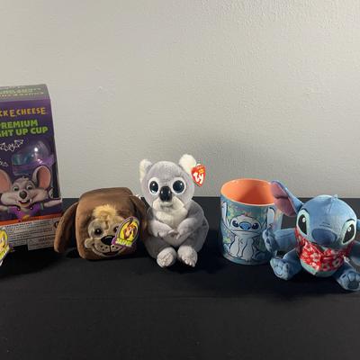 Assortment Of Chuck E. Cheese, Stitch And Other Stuffed Toys/Items