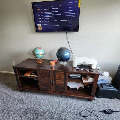 Wood L-shaped desk and console  $275
Smart TV  $150
Printer $35