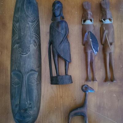 Tribal Treasures – Hand-Carved African Wood Figures and Mask Collection