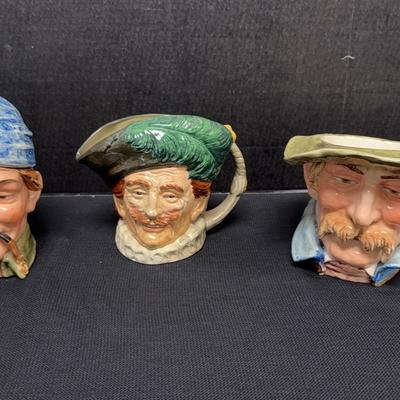 Royal Doulton “The Cavalier” Toby Pitcher And Two Majolica Jars