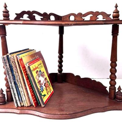 Small Wooden Corner Shelf with an Assortment of Books