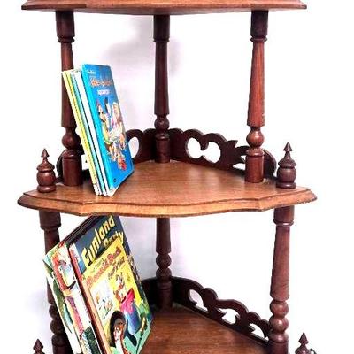 Wooden Corner Shelf with an Assortment of Books