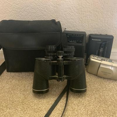 Assortment Of Electronics And Binoculars