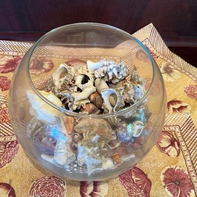 Fish bowl full of seashells